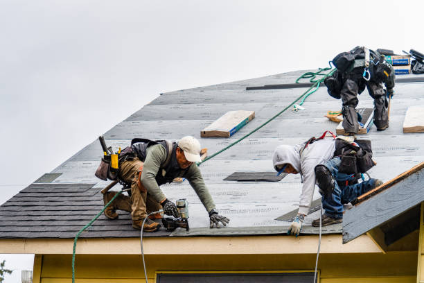 Professional Gutter Installation technician working in Baldwinville, MA